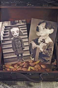 an old suitcase with two pictures in it