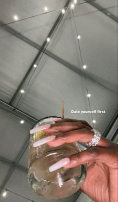 a person holding a drink in their hand with the caption date you're first