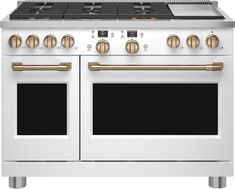 a white stove top oven with two burners and gold trimmings on it