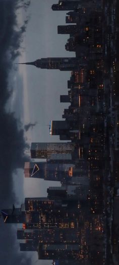 an airplane is flying over the city at night