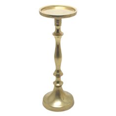 a brass candle holder on a white background