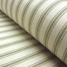 green and white striped upholstered fabric