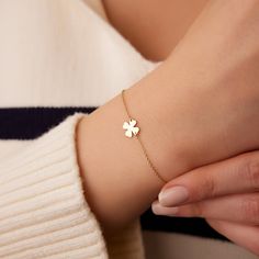 The 14K solid gold clover leaf bracelet features a cable chain made of 14K gold and a small, delicate clover leaf charm. The clover leaf is a classic symbol of luck and is especially important to the Irish, who believe that finding a four-leaf clover is a symbol of good fortune.  ▶ Features * Made to Order.  * Gold KT: 14K Solid Gold * Available Gold Colors: Rose Gold, Yellow Gold, White Gold * Pendant - 7.25mm x 7.75mm * Ready to Ship in 3-5 Business Days ▶ See more of our Gold Bracelets here - http://etsy.me/2l9VKBr ▶ See our storefront here - http://etsy.me/2lUcVnH  ▶ All store sections here * Diamond Rings - http://etsy.me/2lwKUl8 * Diamond Earrings - http://etsy.me/2lyqVBP * Diamond Necklace - http://etsy.me/2mqa6O1 * Diamond Bracelets - http://etsy.me/2mVrAB5 * Diamond Wedding Rings Bracelet Clover, Gold Four Leaf Clover, Solitaire Bracelet, Four Leaf Clover Charm, Gold Heart Bracelet, Gold Armband, White Gold Pendant, Clover Charm, Leaf Bracelet