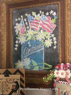 an american flag in a mason jar with daisies and flowers is on the mantle