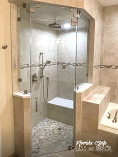 a walk in shower sitting inside of a bathroom