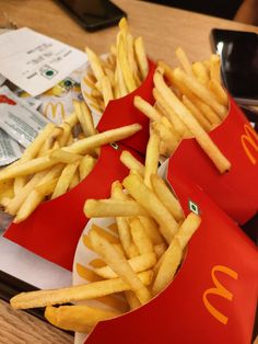 french fries and mcdonald's are sitting on the table