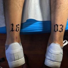 two people with matching tattoos on their legs, one has the number thirteen and the other has an arrow