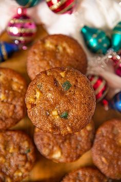 some cookies are sitting on a table next to christmas ornaments