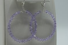 "Light purple Swarovski Crystals are used to design this stunning pair of hoop earrings. The 4mm crystals are on a sturdy rounded wire which dangles from a sterling silver plated lever back ear wire. These earrings will dangle approximately 2\" from the base of the ear wire. The diameter of these hoops is 1 3/4\". The lever back ear wires are so comfortable you might forget that you have them on." Poughkeepsie Ny, Earrings Purple, Large Crystal, Purple Earrings, Swarovski Crystal Earrings, Large Hoop Earrings, Swarovski Earrings, Cute Bracelets, Purple Crystals