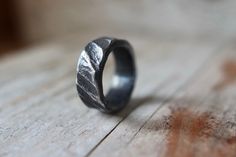 a close up of a ring on a wooden surface