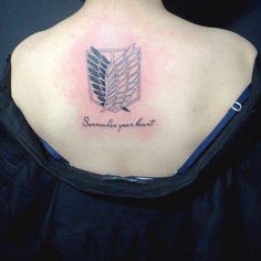 the back of a woman's shoulder with a tattoo on it