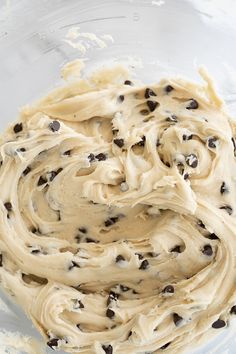 a mixing bowl filled with batter and chocolate chips