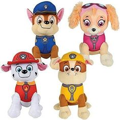 three stuffed animals with hats on and one dog wearing a fireman's uniform