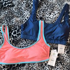 Nwt Juniors Large (Medium Womens) Lot (2) Nobo Pink Metallic/Light Blue Trim Clasp Back Removable Pads Pit To Pit Approx 15” And Shiny Navy (Storm) Blue Sport Bra Like Removable Pads Pit To Pit Approx 15 1/2” Polyester And Spandex Summer Stretch Sports Bra For Pool, Blue Athleisure Tops For Poolside, Sporty Pink Sports Bra For The Beach, Summer Blue Sports Bra, Pink Sports Bra For Poolside, Sporty Pink Tops For Beach Season, Beachwear Sports Bra For Pool, Pink Sporty Tops For Beach Season, Sporty Blue Swimwear With Bra Friendly Design