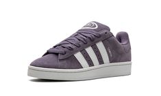 The Women’s adidas Campus 00s “Shadow Violet” is a women’s-exclusive colorway of the sneaker with a retro skate shoe appearance.  Inspired by Y2K-era skateboarding sneaker aesthetics, the adidas Campus 00s is a timeless shoe that can be worn by anyone.  The “Shadow Violet” colorway gives the model a light purple suede appearance with oversized white leather Three Stripes branding on the sides.  “Campus” branding is seen on the lateral side of the mid-panel next to the classic adidas logo detaili Stripes Branding, Adidas Campus 00s, Timeless Shoes, Classic Adidas, Y2k Era, Skate Shoe, Adidas Campus, Purple Suede, Stadium Goods