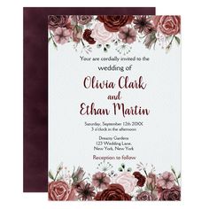 a wedding card with flowers on the front and bottom, in burgundy tones is shown