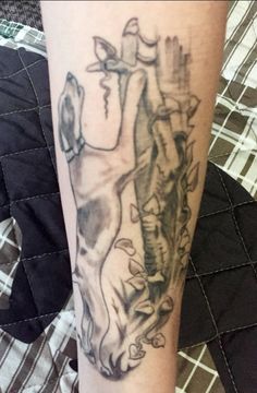 a person with a tattoo on their leg