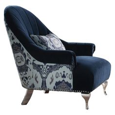 an upholstered chair with blue and white fabric