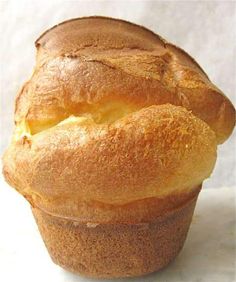 a close up of a muffin on a white surface