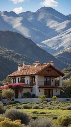 a house with mountains in the background