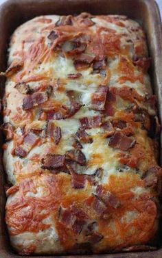 a loaf of bread with bacon on top