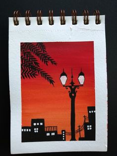 a drawing of a street light and palm tree in front of an orange sky at sunset