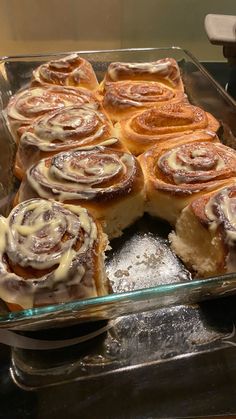 a glass baking dish filled with cinnamon rolls