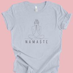 This Namaste Yoga T-Shirt is a peaceful and calming addition to your wardrobe. Made with 100% Airlume combed and ring-spun cotton, this lightweight and breathable tee is perfect for both active yoga sessions and leisure wear. The ribbed knit collar and shoulder tape provide structural support, while the tear-away label minimizes skin irritation. The retail fit and classic crew neckline make it suitable for casual and semi-formal settings, adding a touch of zen to your outfit. Product features - Made with 100% Airlume combed and ring-spun cotton - Ribbed knit collar and shoulder tape for structural support - Lightweight fabric perfect for active and leisure wear - Retail fit suitable for casual and semi-formal settings - Manufactured in a humane, sustainable way by Bella+Canvas Care instruc Yoga Tee Shirt, Meditation Outfit, Yoga Lover Gift, Yoga Tees, Namaste Yoga, Zen Meditation, Meditation Gifts, Yoga Tshirt, Skin Irritation