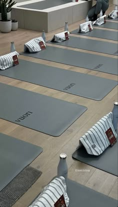 there are many yoga mats lined up on the floor