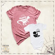 "Introducing our adorable \"Mama Baby Saurus Couple Tee\" - the perfect way to showcase your dino-mite bond with your little one! Crafted with love and care, this tee is designed for both moms and their little sauruses, offering a delightful matching look that's bound to turn heads. Celebrate the special bond between mother and child with this charming shirt, featuring cute dinosaur graphics and vibrant colors. Whether you're out for a stroll in the park, attending a family gathering, or simply Mom Daughter Outfits, Motherhood Shirts, Couple Tees, Mommy Baby, Family Tees, First Mothers Day