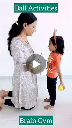 an image of a woman teaching a child how to play with a ball on the floor