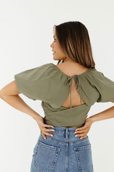 Description Open Back Tie Crop with Puff Sleeve Materials & Care 100% Polyester Hand wash cold, with like colors, no bleach, tumble dry low, iron low, do not dry clean. Hand Measured Small: Length 10", Bust 19(38)", Sleeve 6" Medium: Length 11", Bust 20(40)", Sleeve 6" Large: Length 11.5", Bust 22(44)", Sleeve 6" Model wearing size Small Suede Fringe Vest, Fringe Vest, Cocoon Cardigan, Boho Midi Dress, Studded Heels, Fringe Boots, Cropped Vest, Fishnet Stockings, Cowgirl Hats