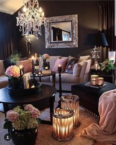 a living room filled with lots of furniture and candles on top of it's coffee table