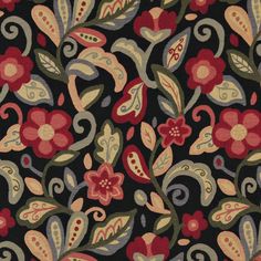 a black background with red and green floral designs on the bottom right corner is an area rug that has many different colored flowers in it