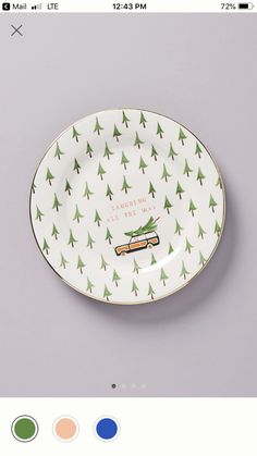 a white and green plate with trees on it