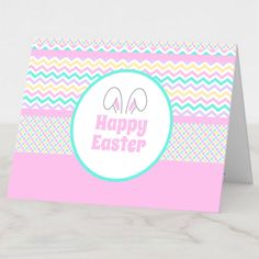 an easter card with the words happy easter in pink, blue and yellow stripes on it