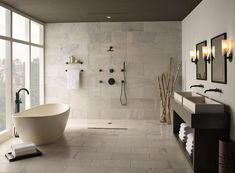 a bathroom with a tub, sink and large window overlooking the cityscape in black and white