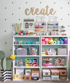 a craft room filled with lots of crafting supplies and crafts on top of bookshelves