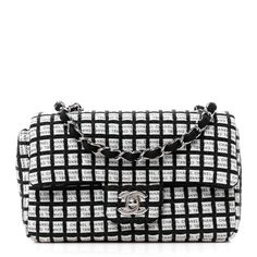 This is an authentic CHANEL Ribbon Tweed Mini Rectangular Flap in Black and Ivory. This mini flap is crafted of Chanel logo printed ribbon with square tweed stitching in black and white. The front flap opens with a silver CC turn lock to a fabric interior with a zipper pocket. Chanel Ribbon, Chanel Mini Rectangular, Jersey Quilt, Classic Phones, Chanel Crossbody, Chanel 19, Chanel Tweed, Chanel Flap Bag, Quilted Wallet