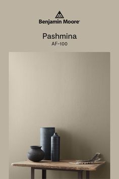 a table with two vases on it and the words pashmina af - 100