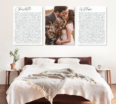 a couple standing next to each other in front of a bed with two pictures on the wall