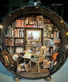 there is a room with many books on the shelves and an old chair in front of it