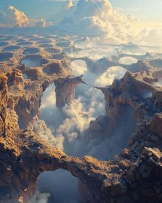 an aerial view of clouds and mountains with a bridge in the middle surrounded by rocks