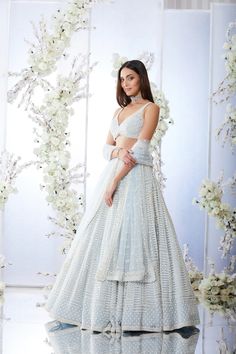 Seema Gujral: This lehenga set features heavy pearl & sequin embroidery. The blouse has a sweetheart neckline. The outfit is paired with an embroidered net dupatta. *This piece includes 3 - 4 inches of additional margin in the bodice/blouse to allow alterations up to 1.5 - 2 dress sizes. Pearl Lehenga, Seema Gujral, Engagement Lehenga, Traditional Indian Dress, Blue Lehenga