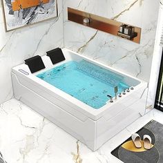 a bathroom with marble walls and flooring has a large jacuzzi tub in the middle