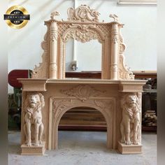 an ornate fireplace with statues on it in a room filled with other furniture and decor