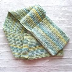 four knitted napkins sitting on top of each other