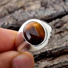 Tiger Eye Ring -Tiger Eye and 925 Sterling Silver Ring -Oval Bezel Set Ring -Classic Modern Gift Ring-Tiger Eye Gemstone Jewelry- Birthstone Tiger Eye is said to stimulate the root chakra and the solar plexus, and is known to help one to take concise and clear actions in response one's inner and outer situations. Tigers Eye is said to be helpful in keeping one grounded and connected with the earth. Tigers eye can help one find harmonious balance between extremes, and also supports physical and e Brown Oval Rings With Natural Stones, Brown Oval Gemstone Rings, Oval Brown Rings With Natural Stones, Oval Brown Ring With Natural Stones, Tigers Eye Wedding Ring, Tiger Eye Ring For Women, Tiger Eye Rings For Men, Tigers Eye Signet Ring, Chakra Racine