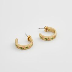 Elevate your style with these charming gold hoops adorned with hand-painted enamel delicate pink flowers. These earrings celebrate the fleeting beauty of spring, a perpetual bloom captured in a timeless design. Key features: Hand-painted enamel Hand-carved detailing 18K Worn-gold plated zinc alloy, enamel 5mm width band; 2mm thick-rounded; 16mm internal diameter Comes in a gift box with cotton pouch Hand Painted Jewelry For Spring, Spring Hand Painted Jewelry, Irish Knit Sweaters, Tweed Purse, Wrendale Designs, Heart Pocket, Tartan Scarf, Irish Cottage, Wool Slippers