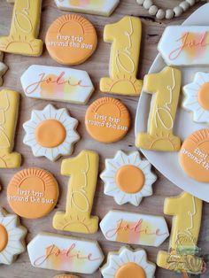 decorated cookies are arranged on a table for a first birthday party or special occasion to celebrate